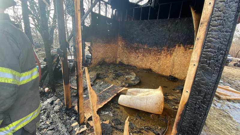 Two horses were killed and several were wounded when this makeshift stable caught fire.
