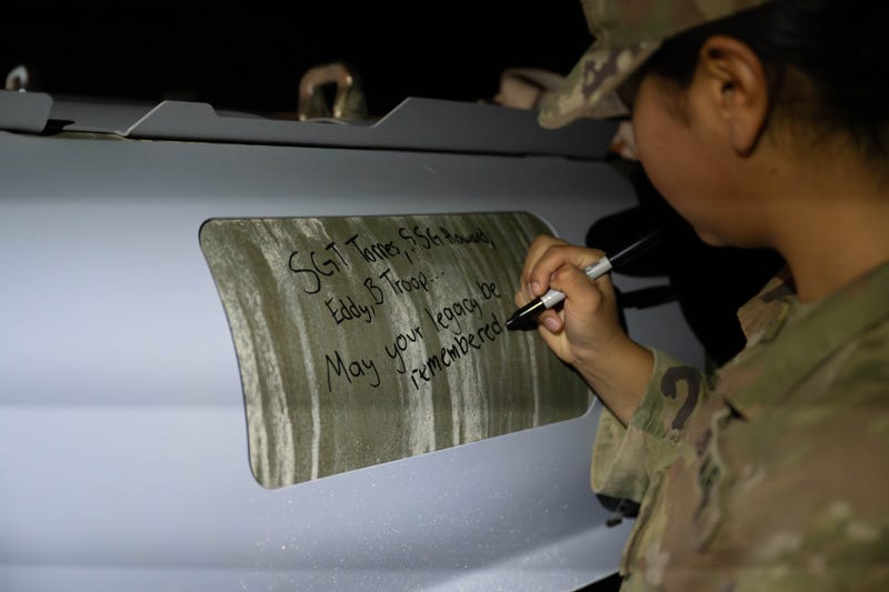 U.S. soldiers attached to the Iowa National Guard sign GBU-31 munitions systems in the U.S. Central Command area of responsibility Dec. 18, 2025.