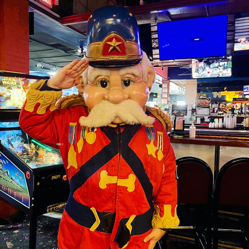 WWJ's Zach Clark tries on Major Magic costume at Sparks Pinball Museum in New Baltimore.