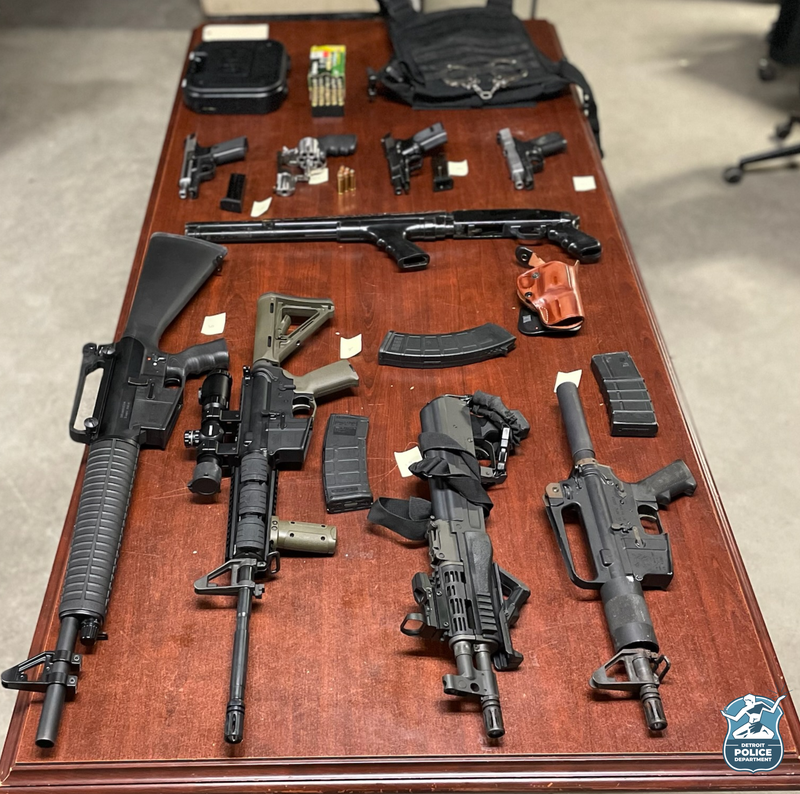 Detroit Police display multiple guns recovered when three warrants were executed