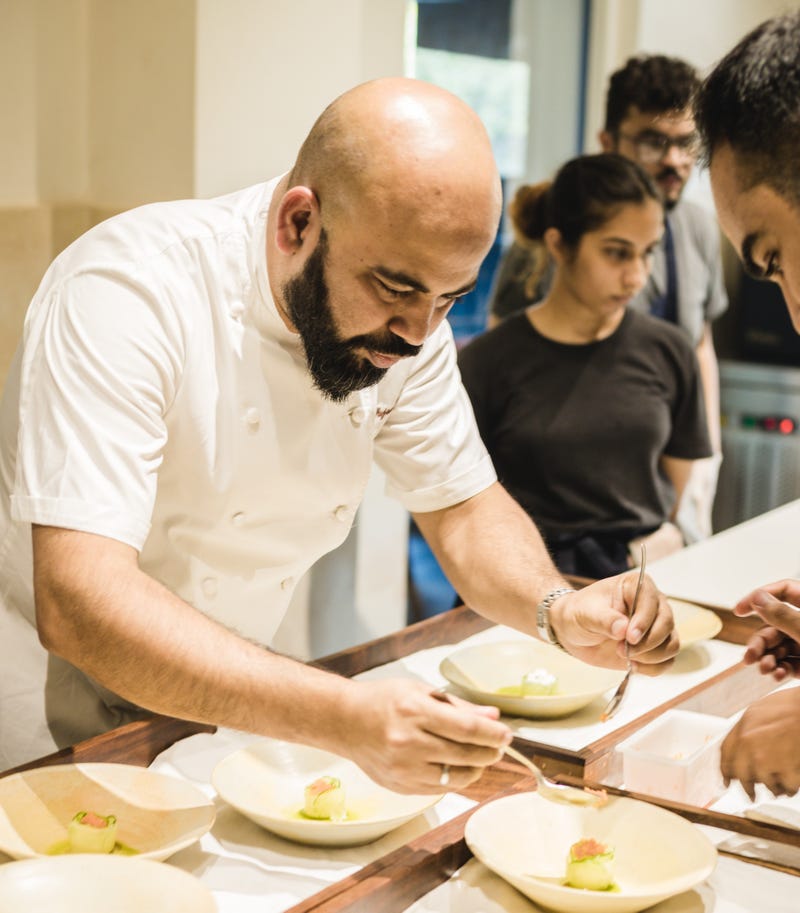 Sujan Sarkar working at Olive Bar and Kitchen in New Delhi. Sarkar said his years of experience in cities that include London, New Delhi, New York City and Dubai all fed into his decision to open Indienne in Chicago's River North neighborhood.