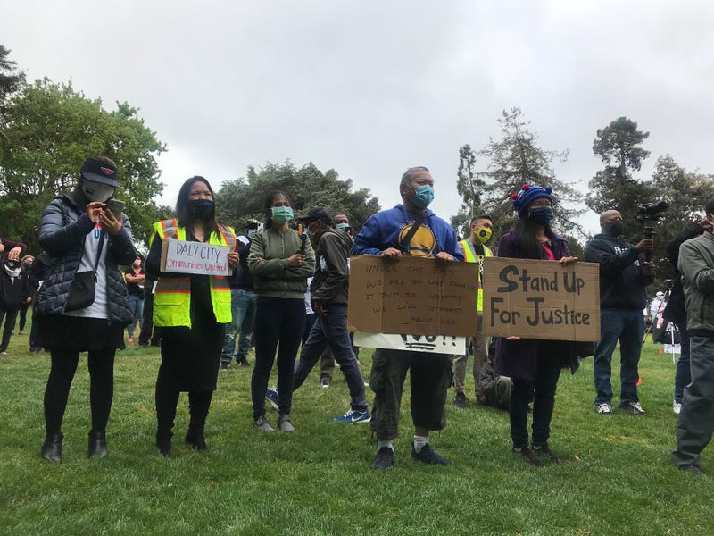 People attend a San Mateo rally against the increase in hate crimes targeting Asian Americans.