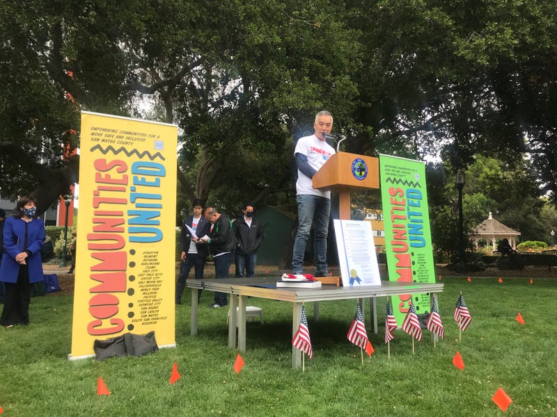 A speaker addresses the crowd at a rally against Asian American hate crimes.