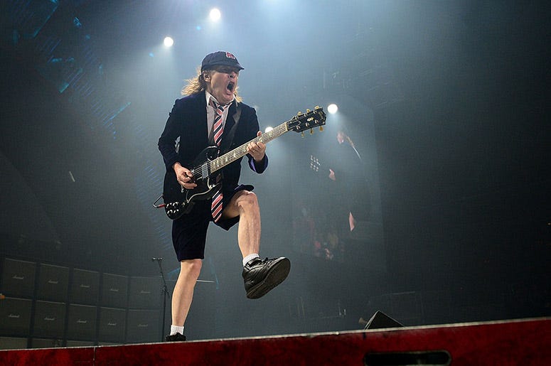 Angus Young performs with AC/DC