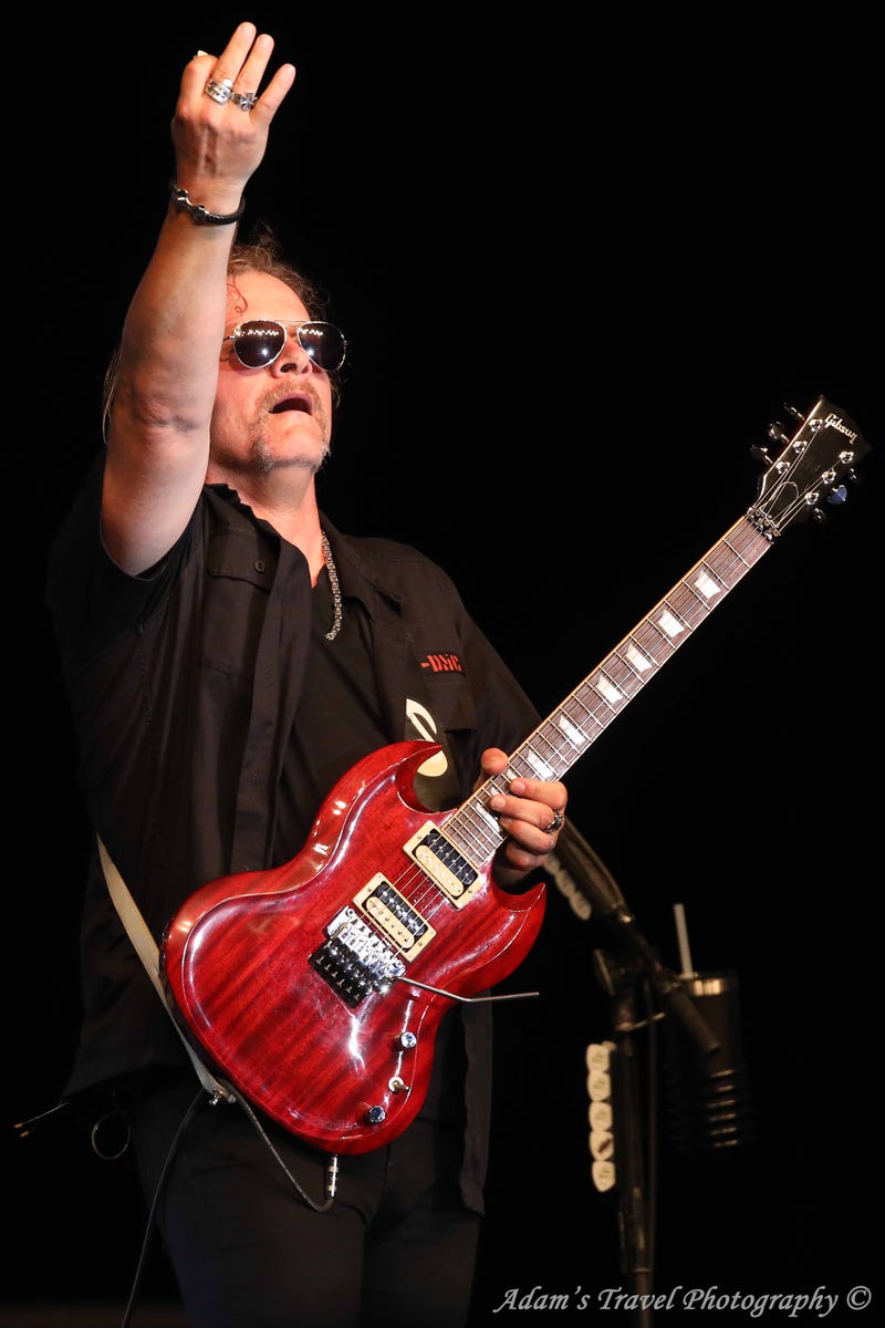 Photo of rock band Tesla performing on-stage