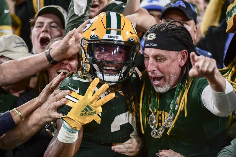 Sep 20, 2021; Green Bay, Wisconsin, USA; Green Bay Packers running back Aaron Jones (33) reacts after scoring his third touchdown of the game against the Detroit Lions in the third quarter at Lambeau Field. Mandatory Credit: Benny Sieu-USA TODAY Sports