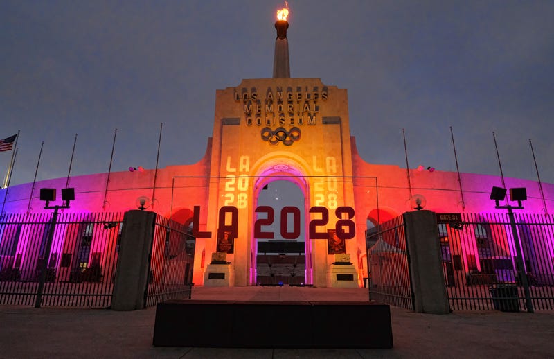 A blazing Olympic cauldron is seen at the Los Angeles Memorial Coliseum on Wednesday, Sept. 13, 2017. The cauldron was lit early Wednesday morning at the stadium that was the site of the 1932 and 1984 Olympics. An International Olympic Committee meeting in Peru is to make it official that LA will host in 2028 and that the 2024 Games will go to Paris.