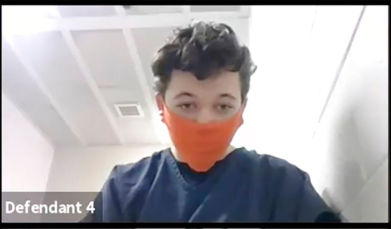 In this screen grab from video Kyle Rittenhosue appears during his initial court appearance in Kenosha, Wis.,on Monday Nov. 2, 2020. Court Commissioner Loren Keating has set cash bail for Rittenhosue, accused of killing two people in August during a protest in Wisconsin at $2 million.