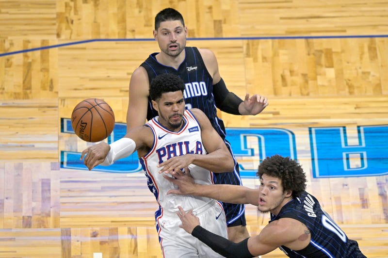 Philadelphia 76ers forward Tobias Harris, front left, passes the ball.