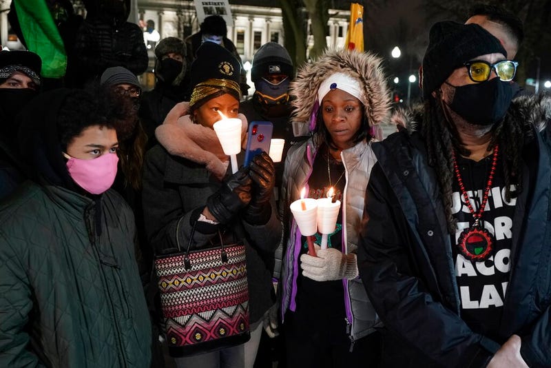 Supporters hold candles at a rally for Jacob Blake, Monday, Jan. 4, 2021, in Kenosha, Wis. Kenosha Police Officer Rusten Sheskey opened fire on Blake in August after responding to a domestic dispute, leaving him paralyzed.