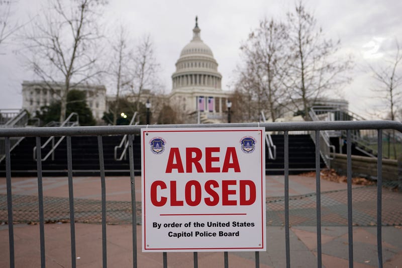 In this Monday, Jan. 11, 2021, file photo, signs are posted to close the area around the U.S. Capitol ahead of the inauguration of President-elect Joe Biden and Vice President-elect Kamala Harris in Washington.