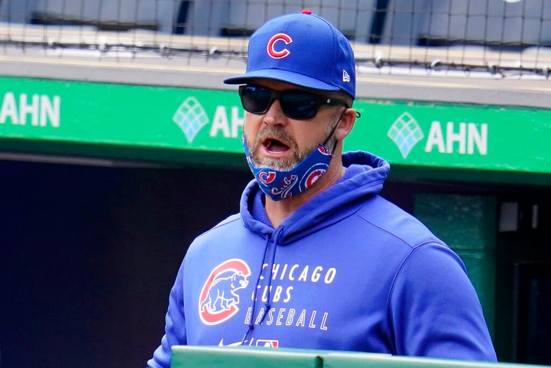 Chicago Cubs manager David Ross stands in the dugout during a baseball game against the Pittsburgh Pirates in Pittsburgh, Sunday, April 11, 2021.