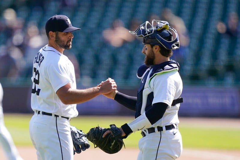 Detroit Tigers relief pitcher Michael Fulmer greets catcher Eric Hasse after saving the ninth inning