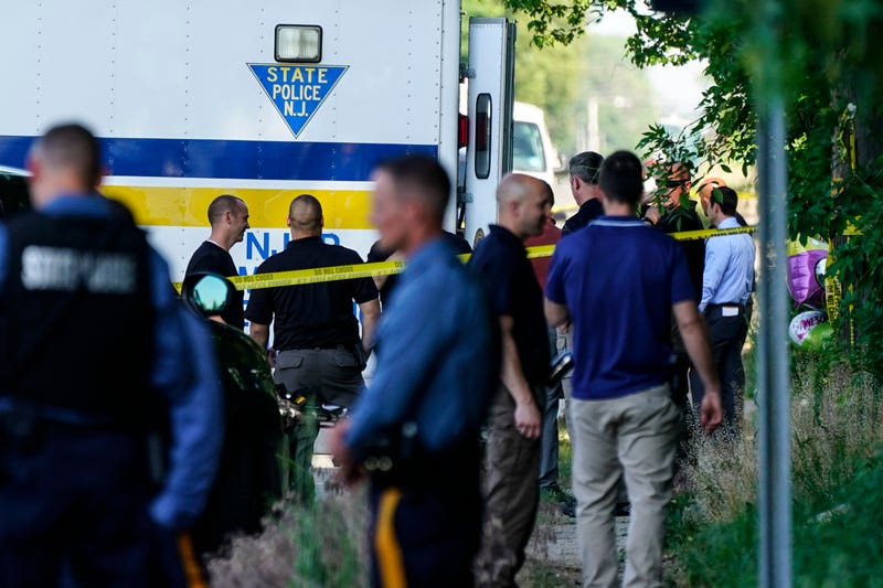 Police gather at the scene of a shooting in Fairfield Township, N.J., Sunday, May 23, 2021