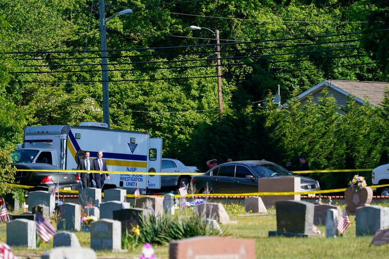 Police gather at the scene of a shooting in Fairfield Township, N.J., Sunday, May 23, 2021