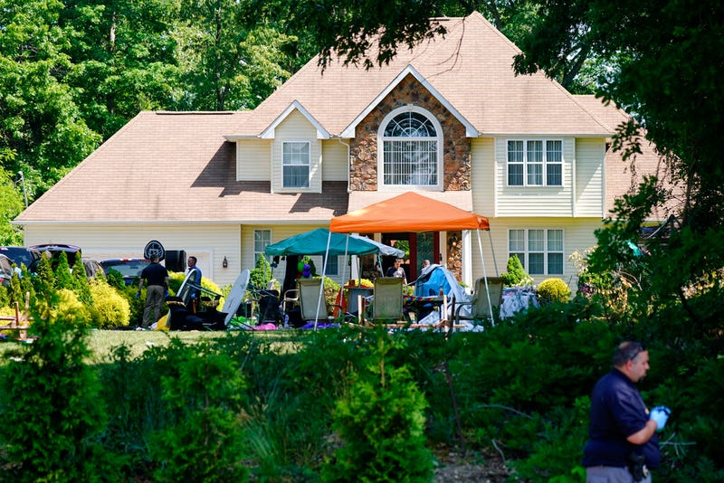 Investigators works the scene of a shooting in Fairfield Township, N.J., Sunday, May 23, 2021. (AP Photo/Matt Rourke)