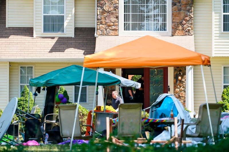 Investigators works the scene of a shooting in Fairfield Township, N.J., Sunday, May 23, 2021.