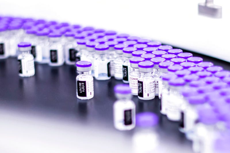In this March 2021 photo provided by Pfizer, vials of the Pfizer-BioNTech COVID-19 vaccine are prepared for packaging at the company’s facility in Puurs, Belgium. Pfizer is about to seek U.S. authorization for a third dose of its COVID-19 vaccine, saying Thursday, July 8, 2021, that another shot within 12 months could dramatically boost immunity and maybe help ward off the latest worrisome coronavirus mutant. 