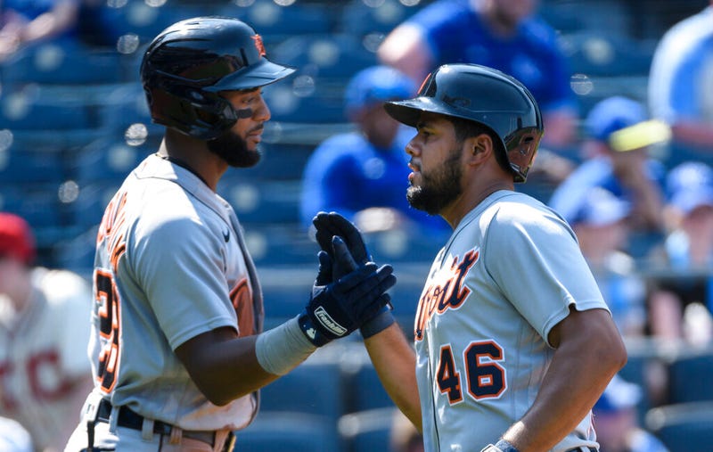 Detroit Tigers' Jeimer Candelario, right, is congratulated by teammate Niko Goodrum