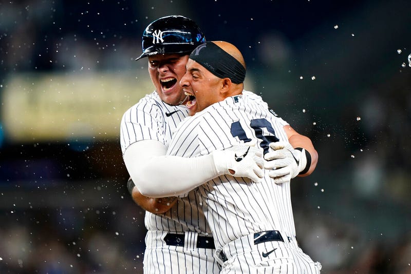 Luke Voit celebrates with Yankees Rougned Odor after hitting a ninth-inning, walk-off RBI single