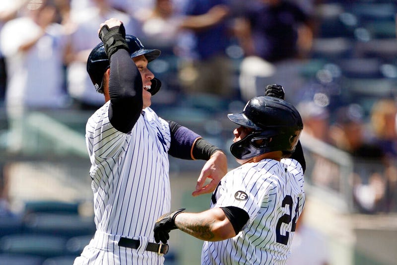 New York Yankees Aaron Judge, left, celebrates with Gary Sanchez (24) after scoring on Sanchez's sixth-inning, three-run home run
