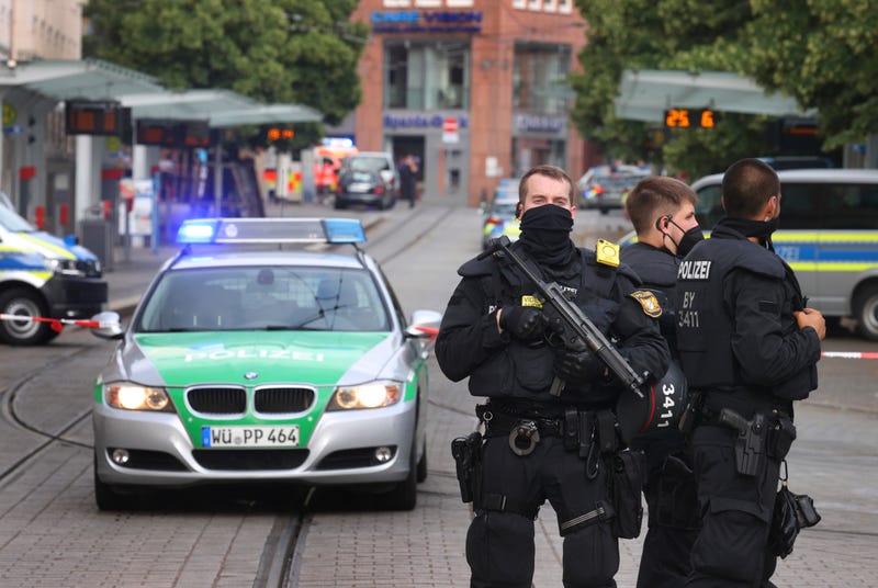 Police cars attend the scene of an incident in Wuerzburg, Germany, Friday June 25, 2021. German police say several people have been killed and others injured in a knife attack in the southern city of Wuerzburg on Friday. (Karl-Josef Hildenbrand/dpa via AP)