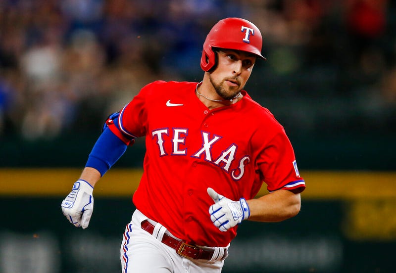 Texas Rangers' Nate Lowe runs to third on a two RBI triple during the fourth inning