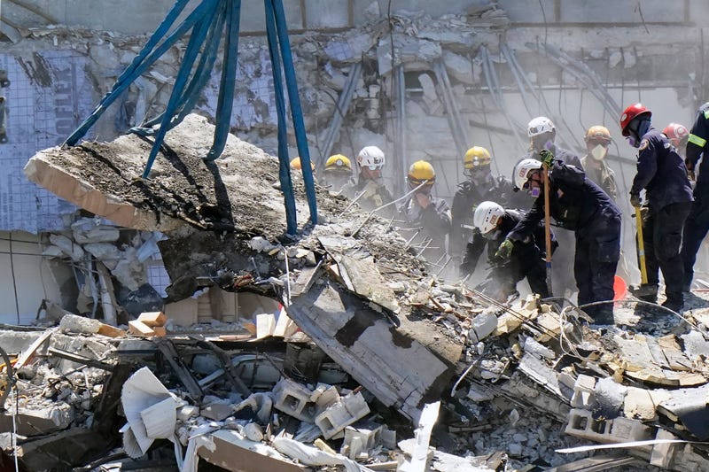 Crews work in the rubble at the Champlain Towers South Condo, Sunday, June 27, 2021, in Surfside, Fla. Many people were still unaccounted for after Thursday's fatal collapse.