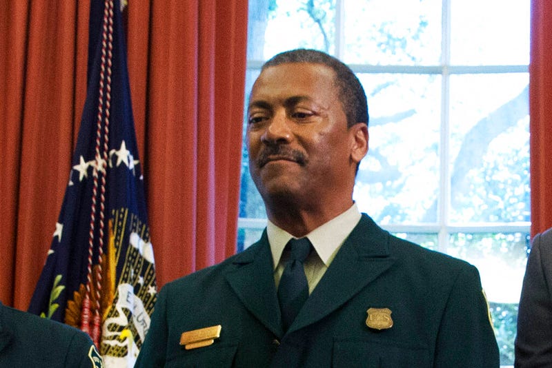 FILE - In this July 10, 2015, file photo Randy Moore, of the U.S. Forest Service, listens as President Barack Obama talks about the designation of three new national monuments in the Oval Office of the White House in Washington. Veteran forester Randy Moore has been named chief of the U.S. Forest Service, the first African American to lead the agency in its 116-year history. (AP Photo/Jacquelyn Martin, File)