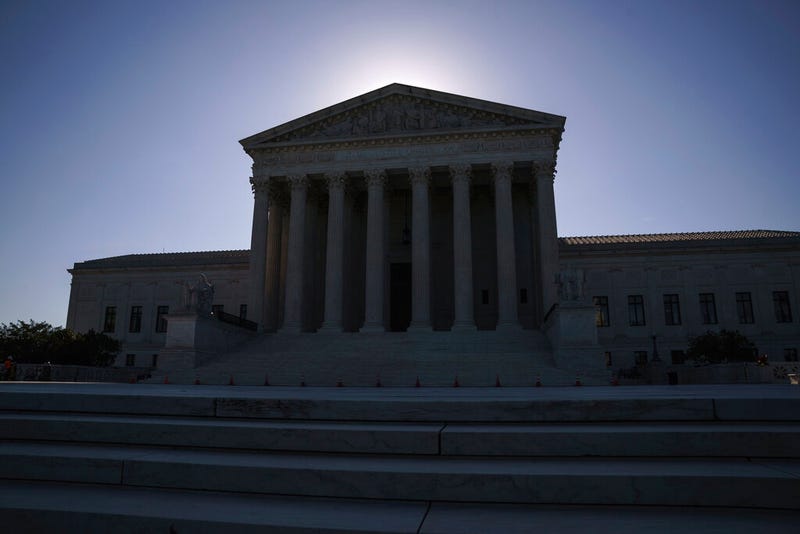 This June 29, 2021, file photo shows the U.S. Supreme Court on Capitol Hill in Washington. The Supreme Court is wrapping up its first all-virtual term, with decisions expected in a key case on voting rights and another involving information California requires charities to provide about donors.