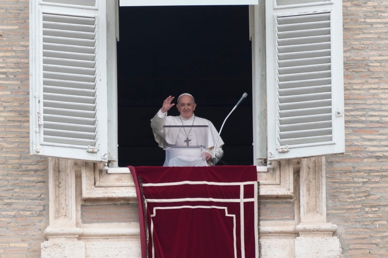 In this June 29, 2021, file photo, Pope Francis salutes from the window of his studio overlooking St. Peter's square at the Vatican, as he recites the Angelus prayer. The Vatican has detailed laws, rituals and roles to ensure the transfer of power when a pope dies or resigns. Even though Pope Francis is recovering from intestinal surgery in a Rome hospital, he is still very much in charge. (AP Photo/Gregorio Borgia, File)