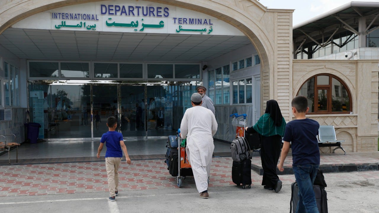 Afghan woman in limbo at Kabul airport after Taliban sweep