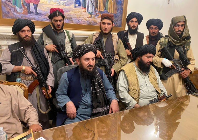 Taliban fighters take control of Afghan presidential palace after the Afghan President Ashraf Ghani fled the country, in Kabul, Afghanistan, Sunday, Aug. 15, 2021.
