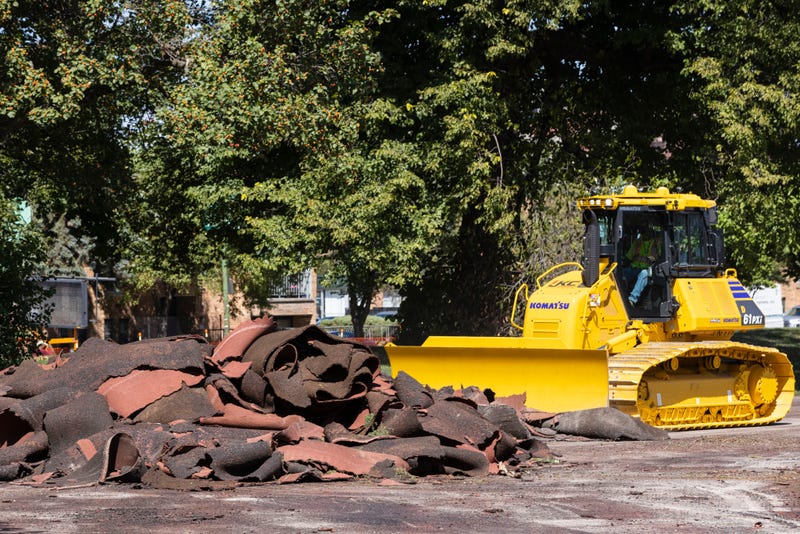 Construction crews tear up the turf field and track in Jackson Park starting construction on The Barack Obama Presidential Center in Chicago on Monday, Aug. 16, 2021.