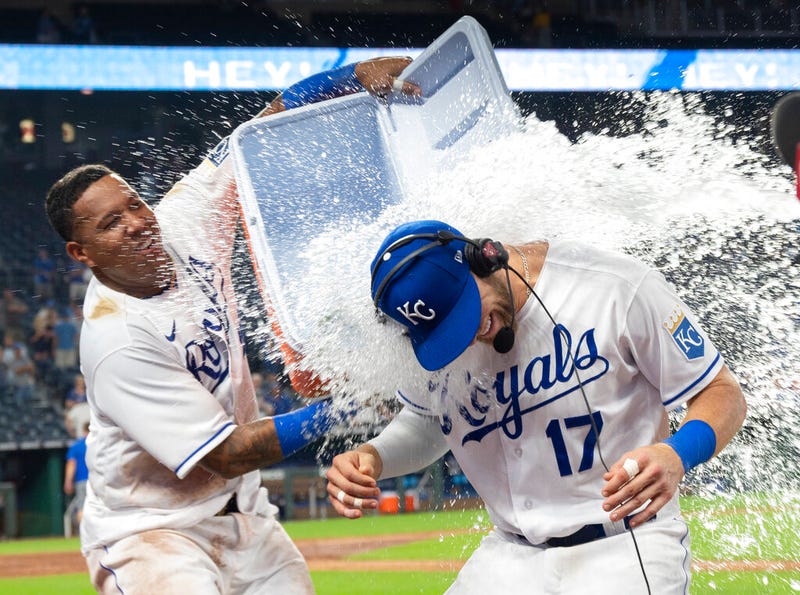 Salvador Perez dumps a cooler of water onto Hunter Dozier (17) after the Royals' 3-2 win over the Houston Astros