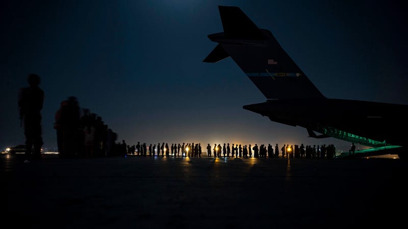 Gunfire at Kabul airport kills 1 amid chaotic evacuations