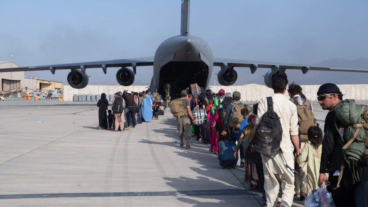Official: Islamic State group believed to be behind 2 suicide attacks at Kabul airport