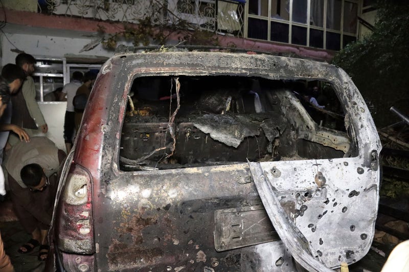 A destroyed vehicle is seen inside a house after a U.S. drone strike in Kabul, Afghanistan, Sunday, Aug. 29, 2021. A U.S. drone strike destroyed a vehicle carrying "multiple suicide bombers" from Afghanistan's Islamic State affiliate on Sunday before they could attack the ongoing military evacuation at Kabul's international airport, American officials said.