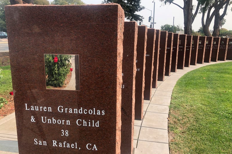 A plaque honors Lauren Grandcolas, who died on United Flight 93, in Union City, Calif., Aug. 17, 2021. Twenty years later, Jack Grandcolas still remembers waking up at 7:03 that morning. He looked at the clock, then out the window where an image in the sky caught his eye — a fleeting vision that looked like an angel ascending. He didn't know it yet, but that was the moment his life changed. Across the country, it was 10:03 a.m. and United Flight 93 had just crashed into a Pennsylvania field. His wife, Lauren, was not supposed to be on that flight.