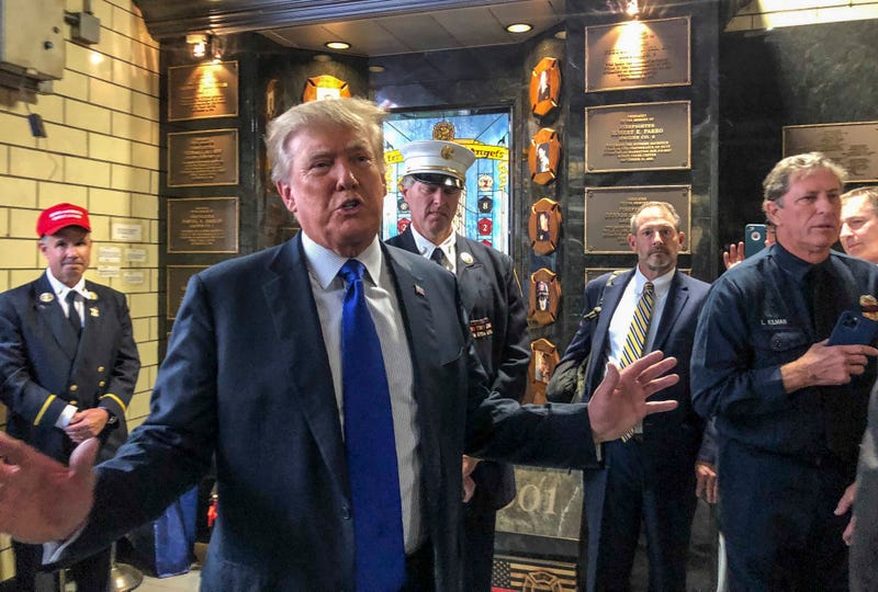 Former President Donald Trump visits the Engine Co. 8 firehouse where he praised first responders' bravery while criticizing President Joe Biden over the pullout from Afghanistan, Saturday Sept. 11, 2021, in New York