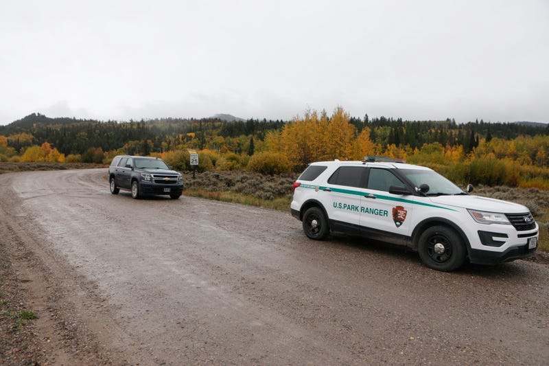A U.S. Park Ranger vehicle drives in the Spread Creek area in the Bridger-Teton National Forest, just east of Grand Teton National Park off U.S. Highway 89, Sunday, Sept. 19, 2021, in Wyoming