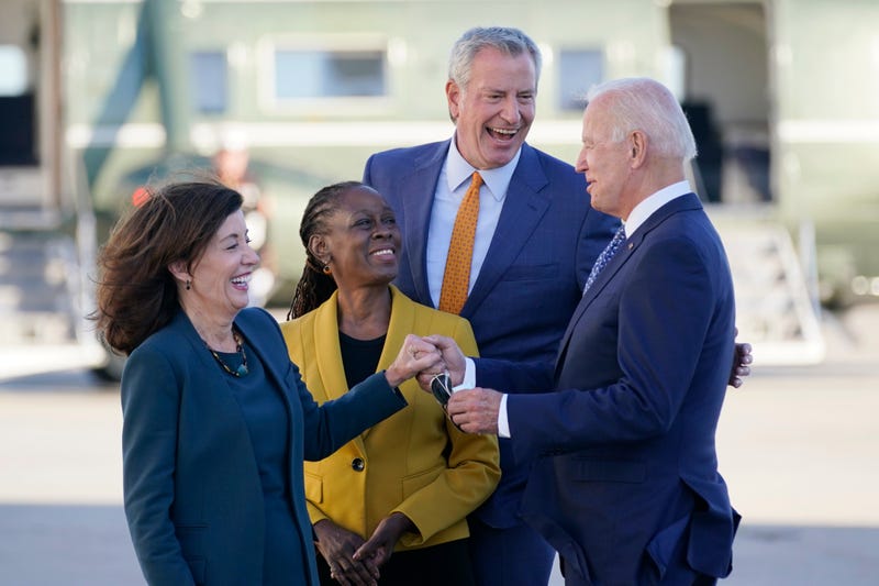 President Joe Biden speaks with New York Gov. Kathy Hochul, left, New York Mayor Bill de Blasio and his wife Chirlane McCray, center left, as he arrives at John F. Kennedy Airport for a two day visit to attend the United Nations General Assembly, Monday, Sept. 20, 2021, in New York