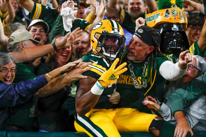 Green Bay Packers' Aaron Jones celebrates his touchdown run