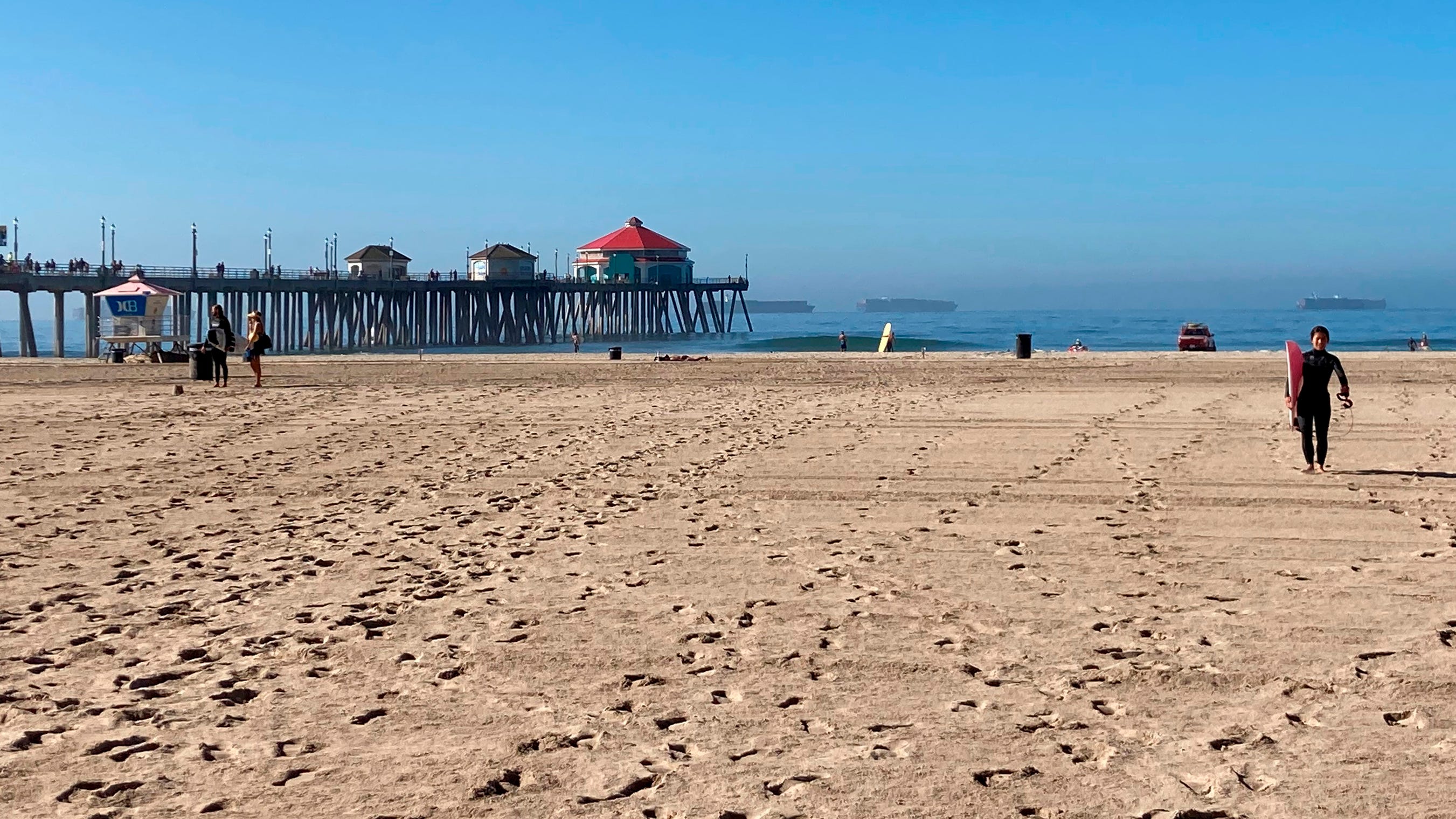 State and city beaches reopen in Huntington Beach after oil spill