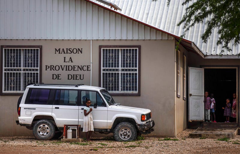 Children stand in the courtyard of the Maison La Providence de Dieu orphanage it Ganthier, Croix-des-Bouquets, Haiti, Sunday, Oct. 17, 2021, where a gang abducted 17 missionaries from a U.S.-based organization.