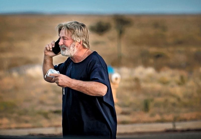 Alec Baldwin speaks on the phone in the parking lot outside the Santa Fe County Sheriff's Office in Santa Fe, N.M., after he was questioned about a shooting on the set of the film "Rust" on the outskirts of Santa Fe, Thursday, Oct. 21, 2021