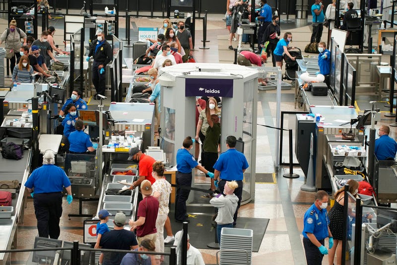 Travelers wear face coverings at airport