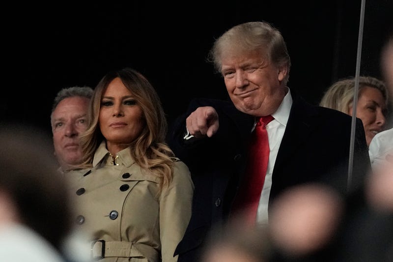 Former President Donald Trump and his wife Melania arrive for Game 4 of baseball's World Series between the Houston Astros and the Atlanta Braves Saturday, Oct. 30, 2021, in Atlanta.