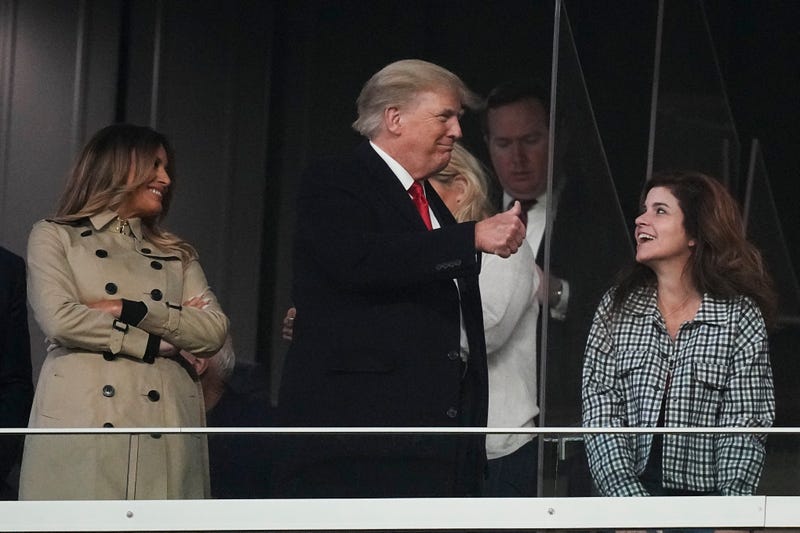 Former President Donald Trump and his wife Melania arrive for Game 4 of baseball's World Series between the Houston Astros and the Atlanta Braves Saturday, Oct. 30, 2021, in Atlanta. (AP Photo/David J. Phillip)