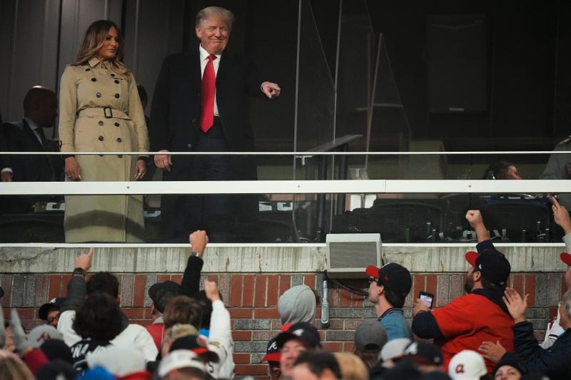 Former President Donald Trump and his wife Melania arrive for Game 4 of baseball's World Series between the Houston Astros and the Atlanta Braves Saturday, Oct. 30, 2021, in Atlanta.